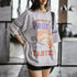 Person wearing a graphic t-shirt with text and a pie illustration.